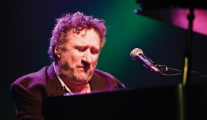 Jon Cleary at the piano. Photo by Golden Richard III.