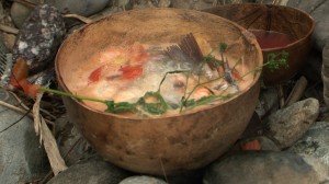 Stone Soup boling in Jicama bowl. The soup is a ritual dish, prepared by men using red hot stones, honoring elders, women, children and distinguished guests of the Chinantec community in Mexico. The bar has imported 200 pounds sacred river stones from Mexico according to owner Cindy Wood.